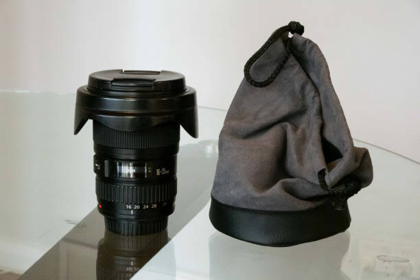 A black 16-35mm camera lens, specifically designed for DSLR or mirrorless cameras, positioned on a clean, neutral white background
