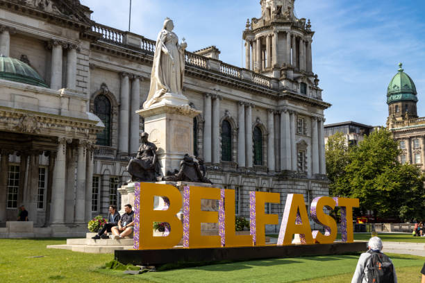 Belfast Northern Ireland, UK - July 31, 2024: This image shows an exterior architectural view of the Belfast City Hall building (Halla na Cathrach Bhéal Feirste), located in Donegall Square.