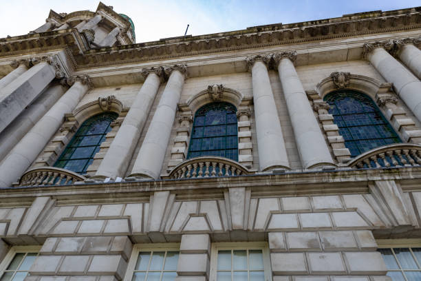 Belfast Northern Ireland, UK - July 31, 2024: This image shows an exterior architectural view of the Belfast City Hall building (Halla na Cathrach Bhéal Feirste), located in Donegall Square.