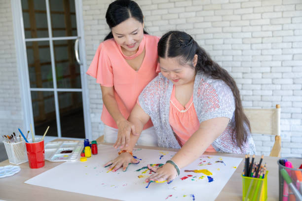 istock A mother and daughter happily doing art activities together at home 2175073738