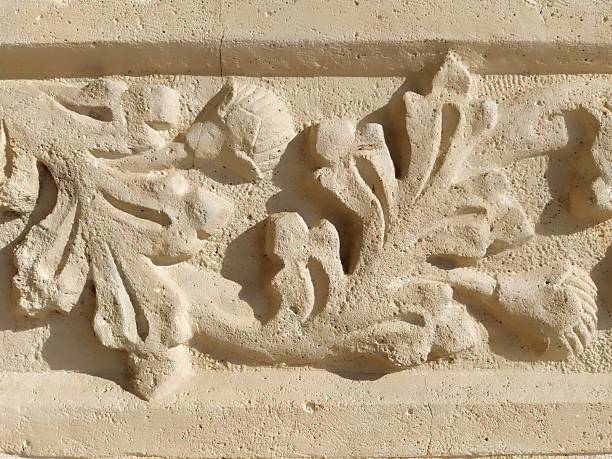 Ornament, sculptural drawing of structured plant elements. Decorating the wall with stucco in Dubrovnik, Croatia. A strip of shamrocks. Acanthus is a herbal vegetation, leaves are stucco elements. Bas-relief on the wall of an old church