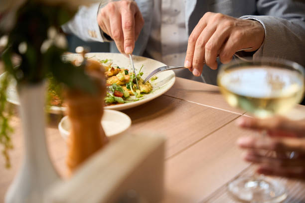 istock Male is having lunch at a table in a restaurant 2175075202