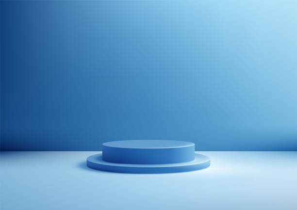istock 3D circular blue podium stands against a blank blue wall background, illuminated by soft diffused light. Ideal for product display, mockup, or showroom 2175076563