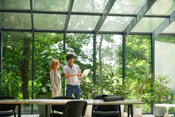 istock Two coworkers discussing at a table in coworking 2175080589