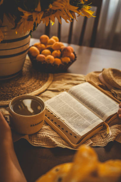 istock Girl reading bible, home evening atmosphere 2175081061