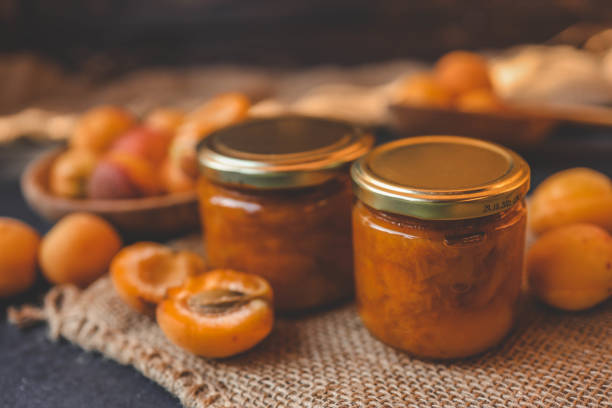 Jar of organic craft apricot jam.