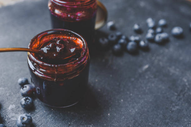 istock Delicious organic blueberry jam on dark background 2175081324