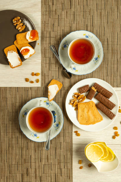 istock Tea with a cracker smothered with cream cheese and jam. 2175082823