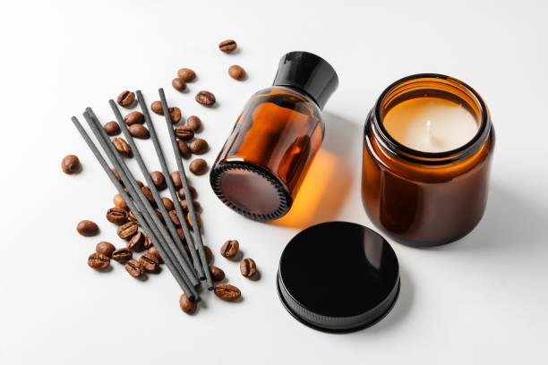 Aromatic coffee-scented candles and essential oils with coffee beans and incense sticks