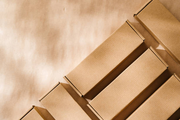 istock Brown cardboard boxes arranged on a neutral background in a warehouse setting during daylight hours 2175082958