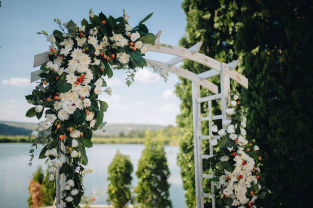 istock Beautiful wedding arch decorated with fresh flowers. 2175083067
