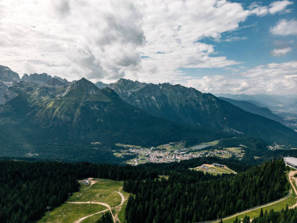 istock Mountain forest overlooking distant rural town under cloudy sky 2175083197