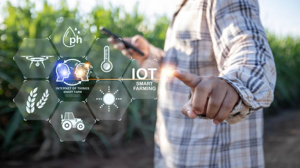 istock A person is pointing at a screen with a smart farming app on it 2175086223