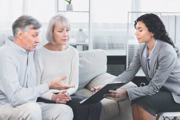 istock Aged couple talking to their financial advisor 2175087225