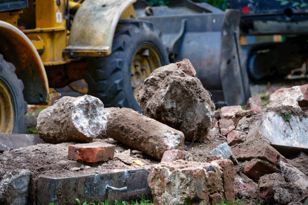 demolition of a gravestone with an excavator