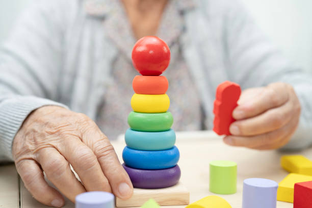 istock Asian elderly woman playing game. 2175093721