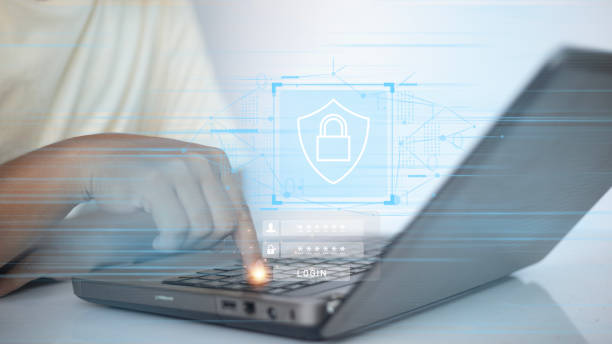 istock A person is typing on a laptop with a blue screen saying 
