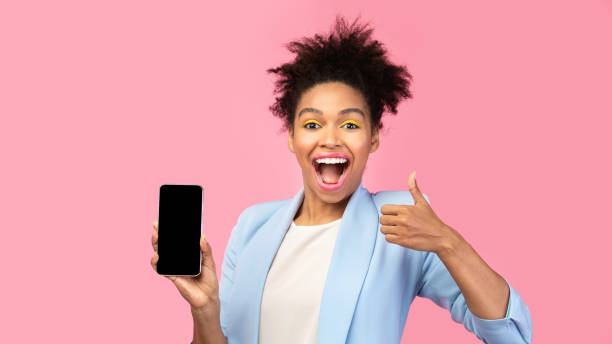 istock Afro woman showing blank black cell phone screen 2175118909
