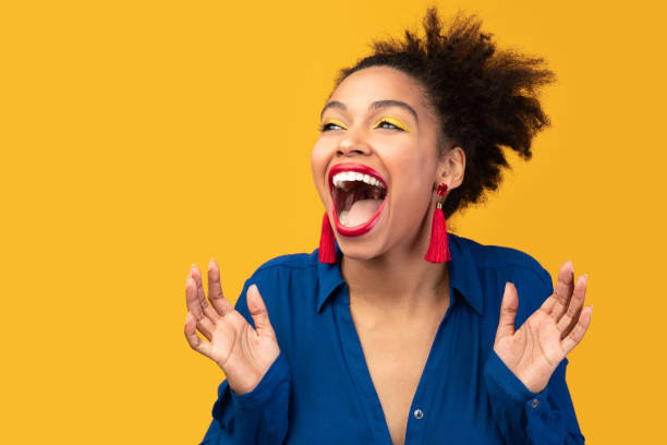 istock Happy afro woman screaming and raising hands 2175119068