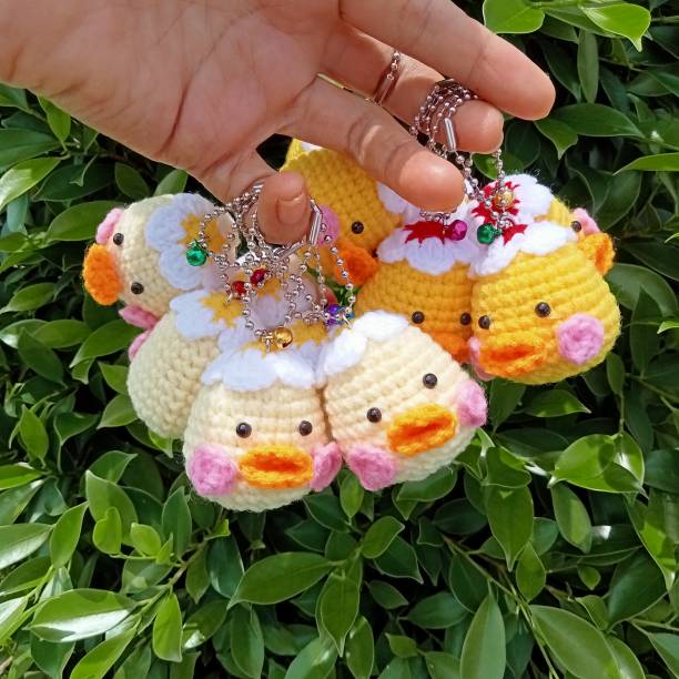 Crochet doll keychain, hand crocheted, handmade animal keychain for background texture, illustration