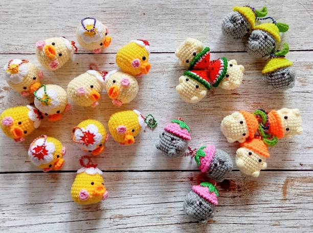istock Crochet doll keychain, hand crocheted, handmade animal keychain for background texture, illustration 2175129262