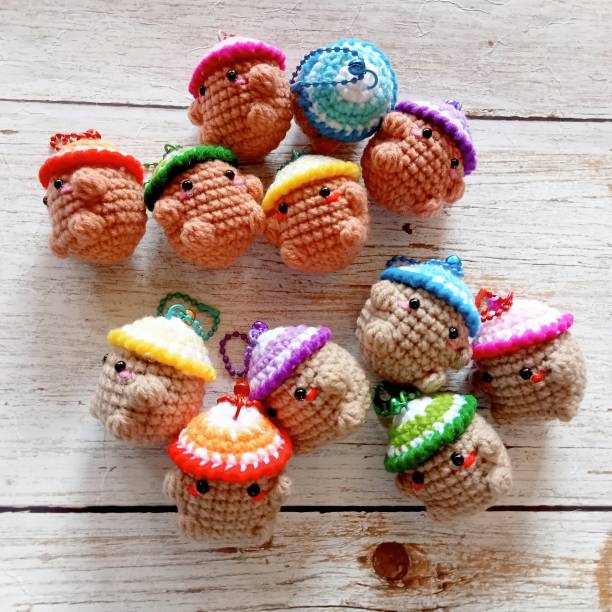 istock Crochet doll keychain, hand crocheted, handmade animal keychain for background texture, illustration 2175129327
