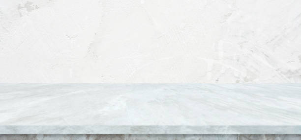 istock Empty white marble table over white cement wall background, White shelf, counter for food and product display montage backdrop, Table top, desk surface banner, mockup, template 2175139104