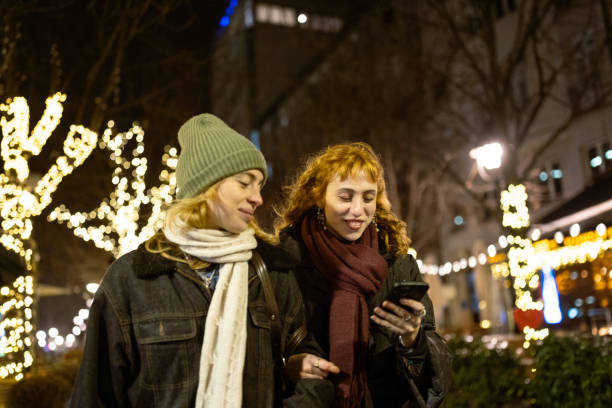 istock Night Stroll with Friends in Festive City Lights 2175141507