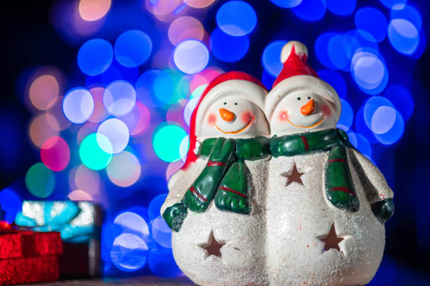istock Snowman Standing with Gift Box on bokeh background. Christman Concept. 2175145469