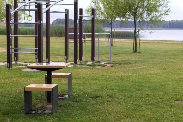 istock .a park bench with a children's playground on the water background 2175152648