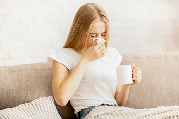 istock Sick Girl with Fever Drinking Hot Tea 2175152859