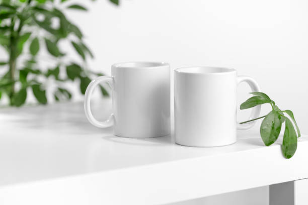 istock Mockup of a white tea cup or coffee mug on a white table in a Scandinavian style kitchen 2175153245