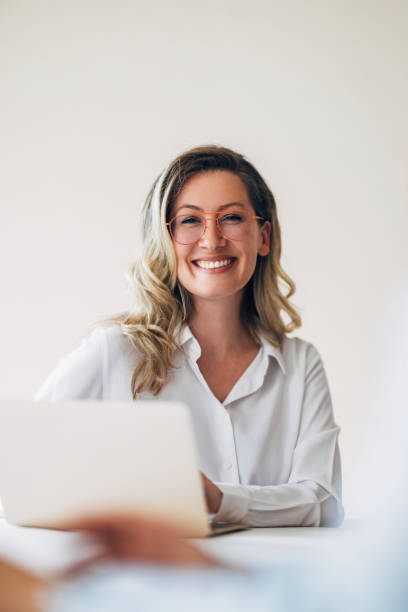 istock Confident Woman Smiling at Work With Laptop 2175153433