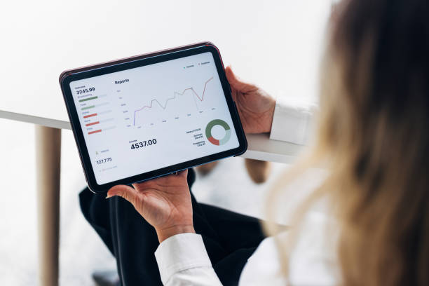 istock Businesswoman Analyzing Financial Data on Digital Tablet 2175153452