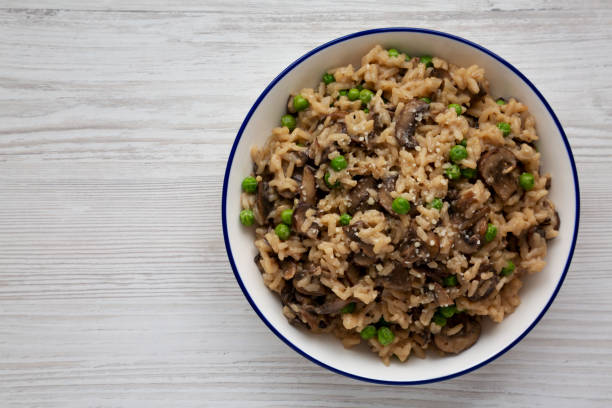istock Homemade Mushroom Risotto with Peas on a Plate, top view. Flat lay, overhead, from above. Copy space. 2175155404