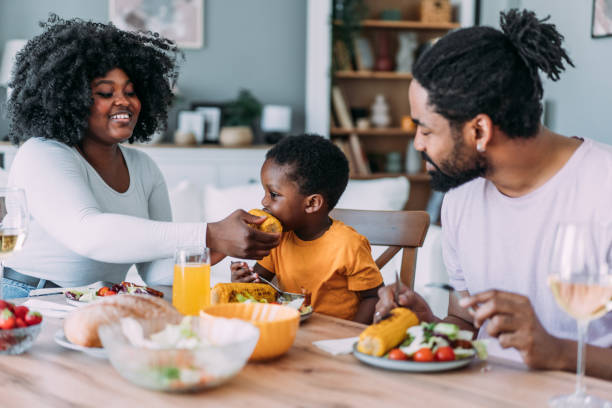 istock Young family enjoying lunch together. 2175155600