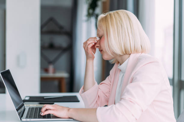 istock Overworked young businesswoman in the office. 2175155676