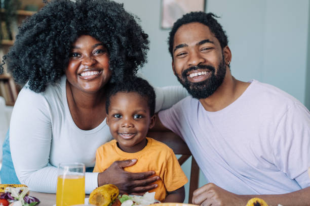 istock Young family enjoying lunch together. 2175155703