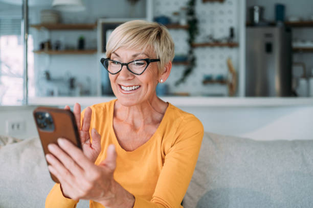 istock Cheerful woman having video call at home. 2175155763