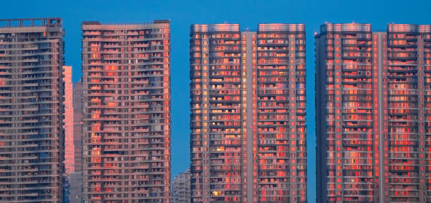 modern apartment buildings reflecting morning red sunlight