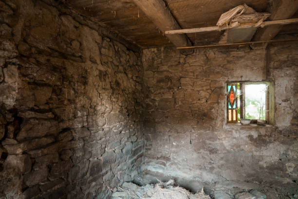 istock A Weathered Stone Room with a Stained Glass Window Illuminating Dusty Corners 2175160031