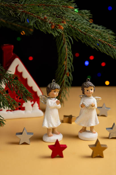 istock Christmas Angels and Holiday Decor with Pine Branches 2175164243