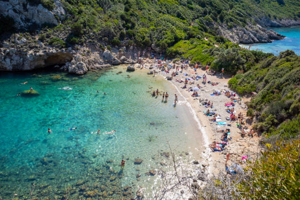 istock A beach with a large crowd of people and a clear blue ocean 2175167578