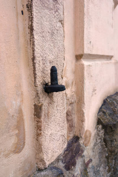 istock Close-up of a black metallic hinge on a wall 2175169875