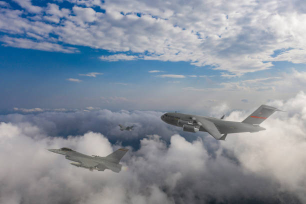 istock Jet fighter aircrafts escorting a C-17 Globemaster III, F-15B Eagle, US Air Force. 2175174202
