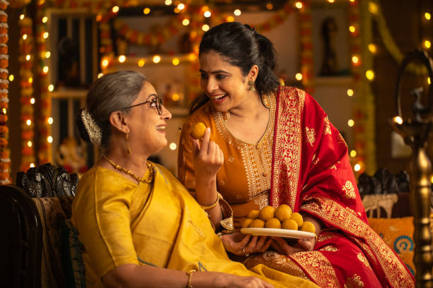 istock Two-generation females enjoying sweets and celebrating Diwali 2175174721