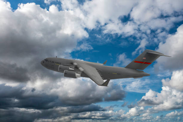 istock US Air Force C-17 Globemaster III transport aircraft. Flying over clouds. 2175176683