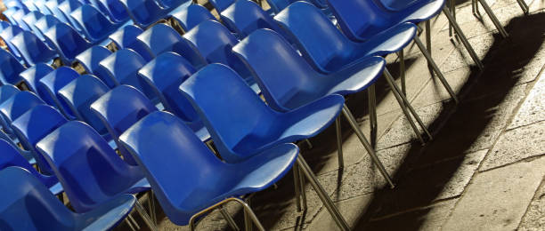 istock empty blue plastic chairs without people before the start of a live concert 2175177218