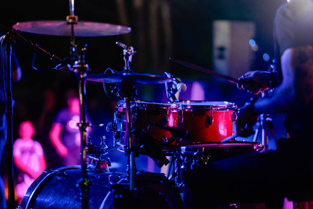 Close-up of a drummer performing during a concert