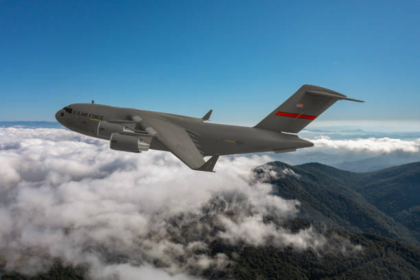 istock US Air Force  C-17 Globemaster III transport aircraft. Flying over clouds. 2175178180